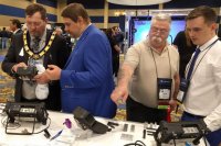 ASNT President Scott Cargill and the participants of the Exhibition are looking at portable flaw detectors of OKOndt GROUP, November 2019, Las Vegas, ASNT-2019