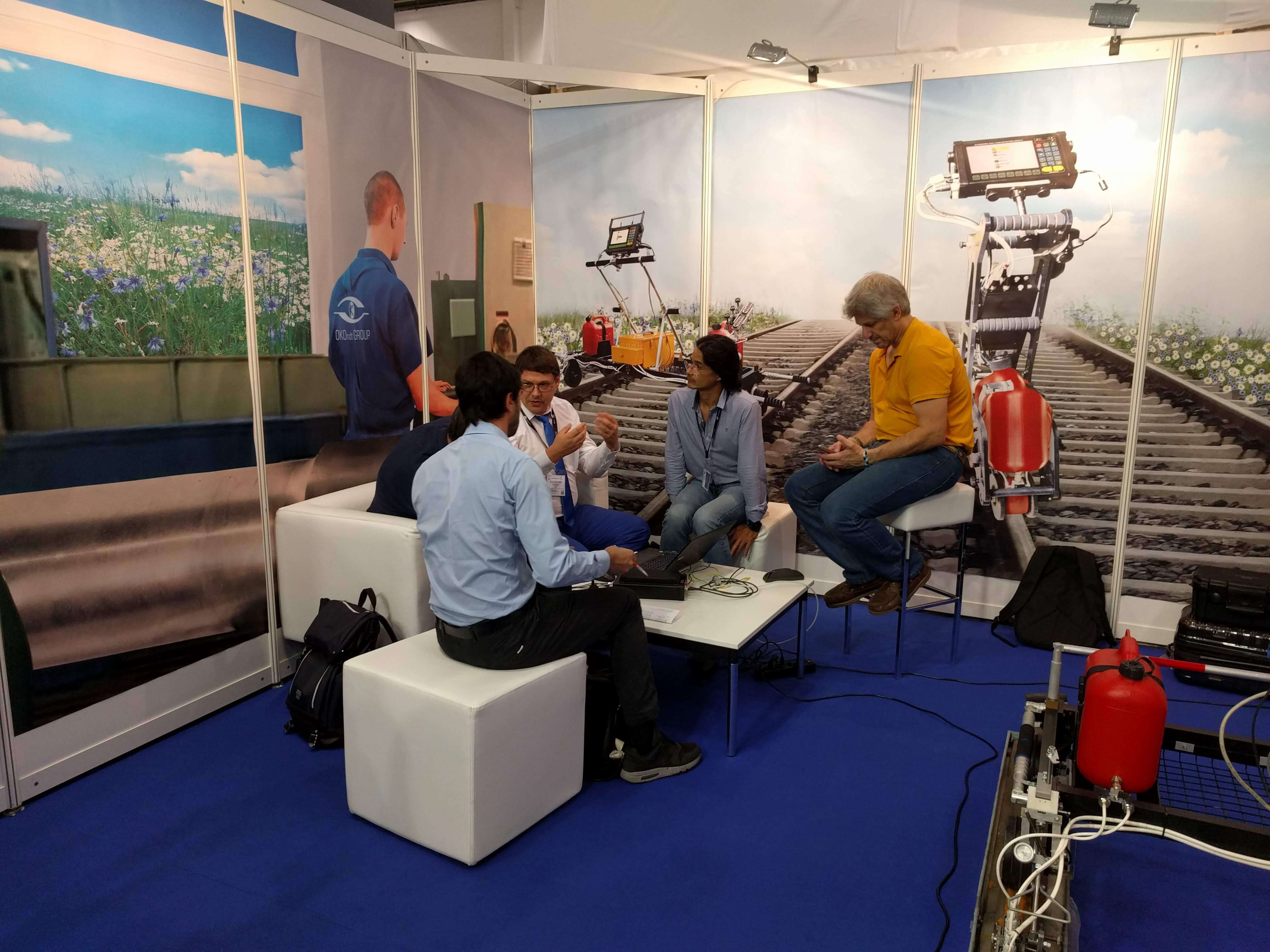 Demonstration and discussion of capabilities of OKOndt GROUP's equipment with interested visitors of the booth