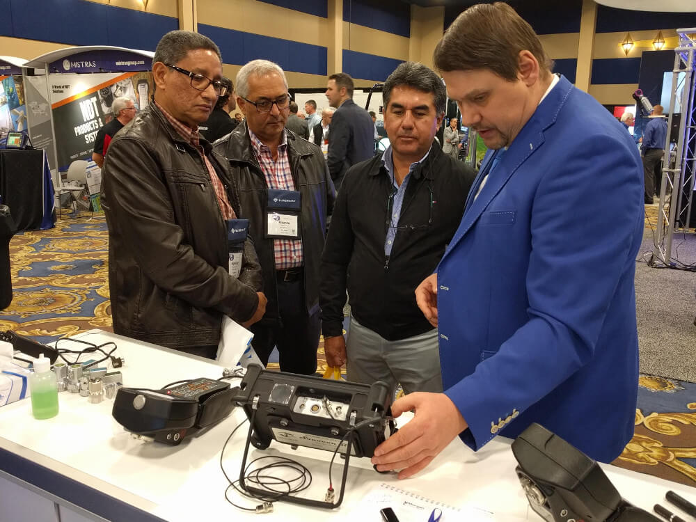 OKOndt GROUP specialist is demonstrating the company's new ultrasonic flaw detector Sonocon BL to the visitors of ASNT Annual Conference-2019